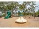 Community playground with slides, swings, and roundabout provides children a safe and fun place to play at 4045 Oxeye Loop, Johns Island, SC 29455