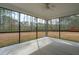 Spacious screened porch with a ceiling fan and views of the backyard at 4045 Oxeye Loop, Johns Island, SC 29455