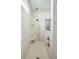 A stunning walk-in shower features marble style tile, rain shower head, handheld sprayer and a built-in bench at 4045 Oxeye Loop, Johns Island, SC 29455