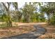 Scenic paved walking path winds through a beautiful park-like setting with mature trees and natural landscaping at 4045 Oxeye Loop, Johns Island, SC 29455