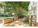 Charming back deck with comfortable seating and scenic views of the lush garden at 405 Springfield Rd, Mount Pleasant, SC 29464