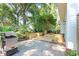 Backyard featuring a grill, patio, and wooden planters, ideal for outdoor gatherings at 405 Springfield Rd, Mount Pleasant, SC 29464