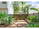 Enclosed backyard featuring a wooden fence and gateway, offering privacy and a defined outdoor space at 405 Springfield Rd, Mount Pleasant, SC 29464