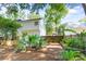 Fenced backyard showcasing the house and a lush green space at 405 Springfield Rd, Mount Pleasant, SC 29464