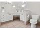 Bathroom features tiled floors, granite vanity, large mirror, and toilet at 405 Springfield Rd, Mount Pleasant, SC 29464