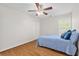 Well-lit bedroom features hardwood floors, a ceiling fan, and a window for natural light at 405 Springfield Rd, Mount Pleasant, SC 29464