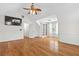 Bonus room features hardwood floors, neutral walls, and a built in bookcase with bright lighting at 405 Springfield Rd, Mount Pleasant, SC 29464