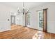 Bright dining room with hardwood floors, wainscoting, and large windows with natural light at 405 Springfield Rd, Mount Pleasant, SC 29464