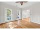 Bright and airy living room featuring hardwood floors, and multiple windows for natural light at 405 Springfield Rd, Mount Pleasant, SC 29464