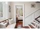 Hallway view leading into a charming bedroom with hardwood floors and a cozy, bright atmosphere at 41 Tradd St, Charleston, SC 29401