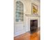 Dining room features built-in hutch, fireplace and hardwood floors at 41 Tradd St, Charleston, SC 29401