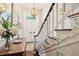 Staircase and entryway of the home with decorative lighting and hardwood flooring at 41 Tradd St, Charleston, SC 29401