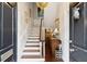 Elegant foyer featuring a staircase, chandelier, and stylish décor, creating a welcoming ambiance at 41 Tradd St, Charleston, SC 29401