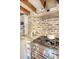 Kitchen featuring stainless steel stove, brick backsplash and granite countertops at 41 Tradd St, Charleston, SC 29401