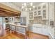 Bright and spacious kitchen featuring stainless steel appliances, island, and white cabinetry at 41 Tradd St, Charleston, SC 29401