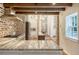 Gourmet kitchen with brick accents, stainless steel appliances, and island that opens to dining at 41 Tradd St, Charleston, SC 29401