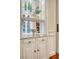Kitchen features include custom cabinetry, granite countertop, and serving area at 41 Tradd St, Charleston, SC 29401