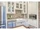 Well-equipped kitchen with a farmhouse sink, stainless steel appliances, and custom cabinetry at 41 Tradd St, Charleston, SC 29401