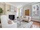 Bright living room featuring a fireplace, neutral color palette, and stylish furnishings at 41 Tradd St, Charleston, SC 29401