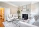 Elegant living room with a fireplace, refined furniture, and ample natural light at 41 Tradd St, Charleston, SC 29401