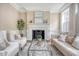 Cozy living room with a fireplace, comfortable seating, and elegant décor at 41 Tradd St, Charleston, SC 29401