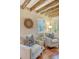 Bright sitting room with hardwood floors and comfortable chairs at 41 Tradd St, Charleston, SC 29401