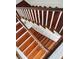 Classic wooden staircase with white risers and handrail, providing a timeless and elegant transition between floors at 41 Tradd St, Charleston, SC 29401