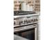 Close-up of a stainless steel stove with oven and cooktop controls at 41 Tradd St, Charleston, SC 29401