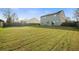 Large, grassy backyard with a privacy fence and ample space for outdoor activities and entertaining at 521 Holiday Dr, Summerville, SC 29483