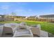 Spacious backyard featuring a patio area with modern chairs and a well-maintained lawn at 521 Holiday Dr, Summerville, SC 29483