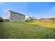 Expansive backyard featuring a well-maintained lawn, privacy fence, and space for outdoor gatherings at 521 Holiday Dr, Summerville, SC 29483