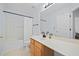 Well-lit bathroom with a shower/tub combo, white shower curtain, and ample counter space at 521 Holiday Dr, Summerville, SC 29483