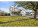 Charming two-story home with a welcoming front porch and well-maintained lawn at 521 Holiday Dr, Summerville, SC 29483