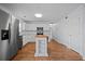Bright kitchen featuring stainless steel appliances, white cabinetry, and hardwood floors at 521 Holiday Dr, Summerville, SC 29483