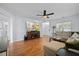 Inviting living room with hardwood floors, comfortable sofa, and a large television at 521 Holiday Dr, Summerville, SC 29483
