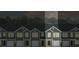Modern townhome showcasing well-maintained exterior and individual garages, under a twilight sky at 539 Golden Embers Way, Summerville, SC 29486