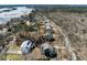 Aerial view of neighborhood with lush trees and waterway views at 5680 Barbary Coast Rd, Hollywood, SC 29449