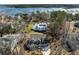 An aerial view shows the home's proximity to the waterfront and neighborhood at 5680 Barbary Coast Rd, Hollywood, SC 29449