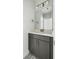 Stylish bathroom with a dark vanity, a bright mirror, and modern lighting, providing a clean and contemporary look at 5680 Barbary Coast Rd, Hollywood, SC 29449