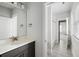 Bathroom featuring a dark vanity with a white countertop, and a glimpse of a tiled shower room in the background at 5680 Barbary Coast Rd, Hollywood, SC 29449