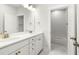 Bright bathroom with double sinks, white cabinets, and elegant fixtures, providing convenience and style at 5680 Barbary Coast Rd, Hollywood, SC 29449