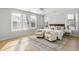 Bright and cozy bedroom with large windows and stylish furniture that has neutral colors at 5680 Barbary Coast Rd, Hollywood, SC 29449