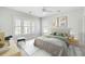 Comfortable bedroom with large windows, a plush bed, and a decorative rug, creating a relaxing atmosphere at 5680 Barbary Coast Rd, Hollywood, SC 29449
