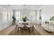 Elegant dining room with a round table and stylish chairs, perfect for entertaining guests at 5680 Barbary Coast Rd, Hollywood, SC 29449