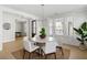 Bright dining area with large windows, offering a pleasant view and plenty of natural light at 5680 Barbary Coast Rd, Hollywood, SC 29449