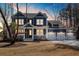 Charming two-story home featuring a welcoming front porch and a spacious three-car garage at 5680 Barbary Coast Rd, Hollywood, SC 29449