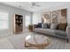 Relaxing living room with a comfortable sofa, a glass coffee table, and a decorative bookcase, offering a cozy retreat at 5680 Barbary Coast Rd, Hollywood, SC 29449