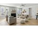 Inviting living room with a fireplace, complemented by neutral tones, modern decor, and natural light at 5680 Barbary Coast Rd, Hollywood, SC 29449