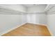 Spacious walk-in closet with built-in shelving providing ample storage, and hardwood floors, offering organization and style at 5680 Barbary Coast Rd, Hollywood, SC 29449