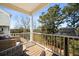 Relaxing back porch with comfortable seating and a grill overlooking the wooded area at 591 Mclernon Trace, Johns Island, SC 29455